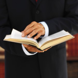 Personal Injury Attorney in Orange County holding law book